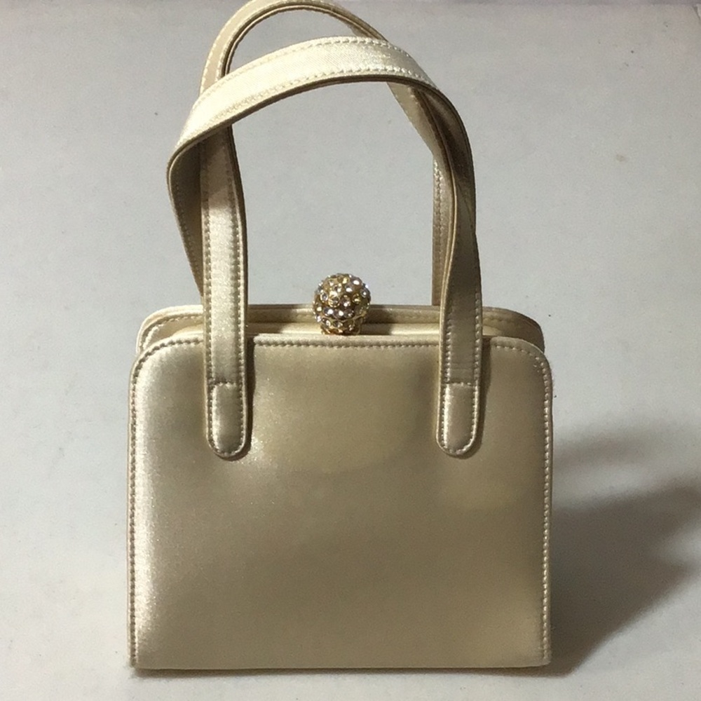 Enzo Angiolini small evening bag light beige w/ gold bauble snap closure.